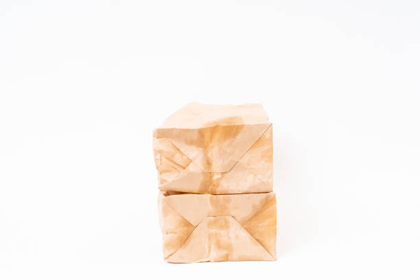 istock Crumpled brown paper bag on white background 1169664834