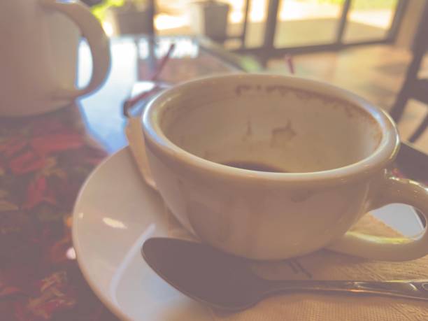 Morning with emty cup coffe with beautiful  light in coffee shop alone