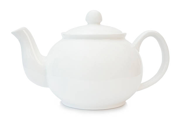 A white tea pot blends into a white background stock photo