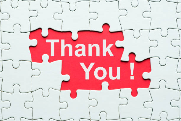 istock Thank you word reveal under jigsaw puzzle 1169665668