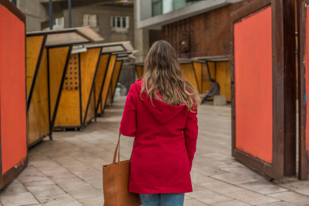 istock Woman in a red coat 1169665670