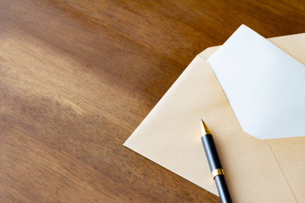 istock Letter envelope and ballpoint pen 1169665737