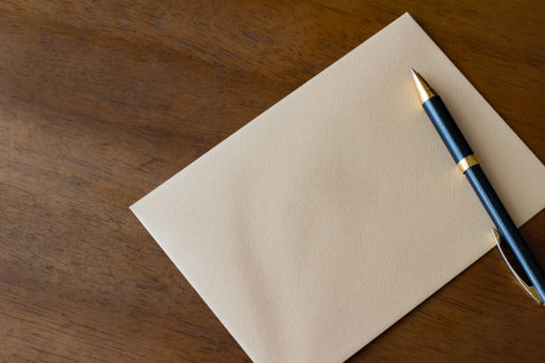 istock Letter envelope and ballpoint pen 1169665746