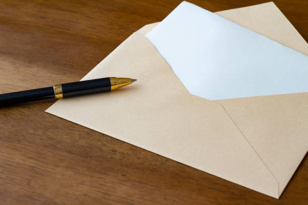 Letter envelope and ballpoint pen stock photo