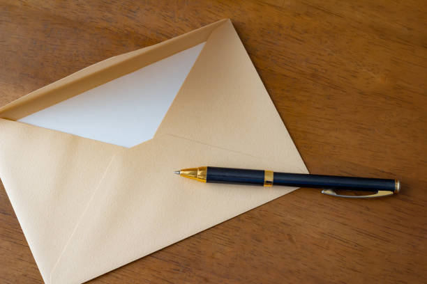 istock Letter envelope and ballpoint pen 1169665760