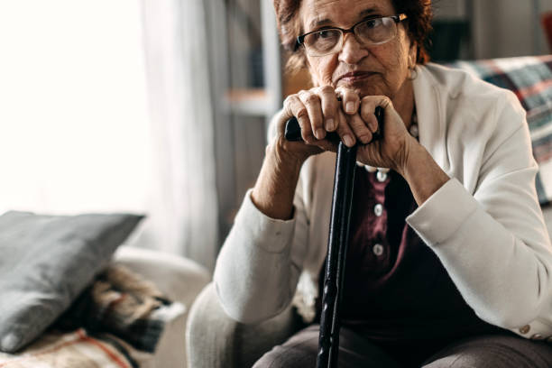 istock Old woman sitting alone 1169665842