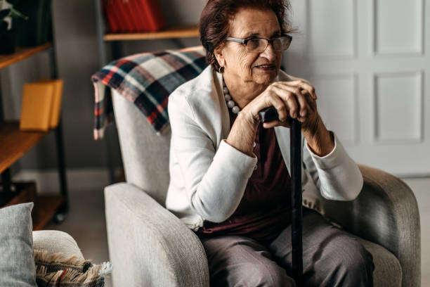 istock Old woman sitting alone 1169671751