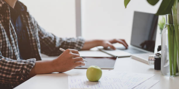 istock Male designer working on his project while typing on laptop 1169673916