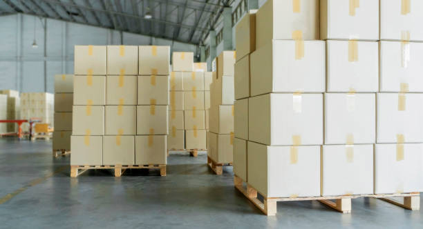 istock stack of cardboard boxes on pallets or cargo shipment at warehouse 1169674488