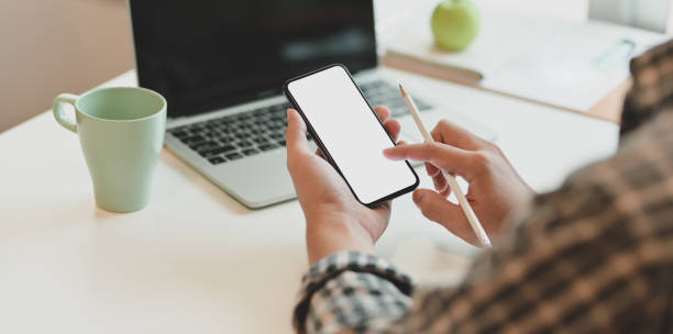 istock Young freelancer searching for new information in smartphone 1169674538