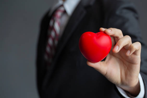 istock Businessmen holding a red heart.customer relationship management 1169676026