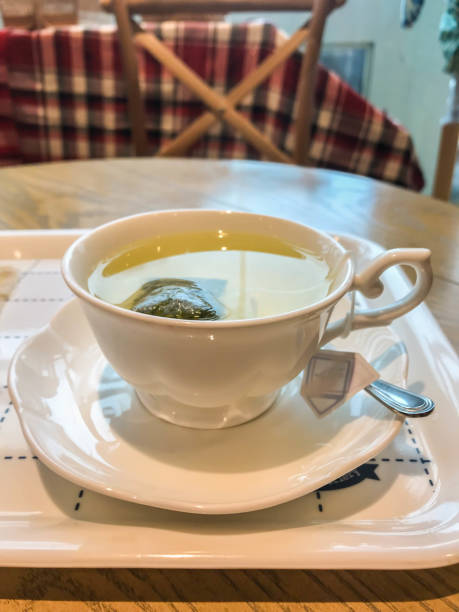 istock close up hot herbal tea in white ceramic cup for afternoon time 1169677837