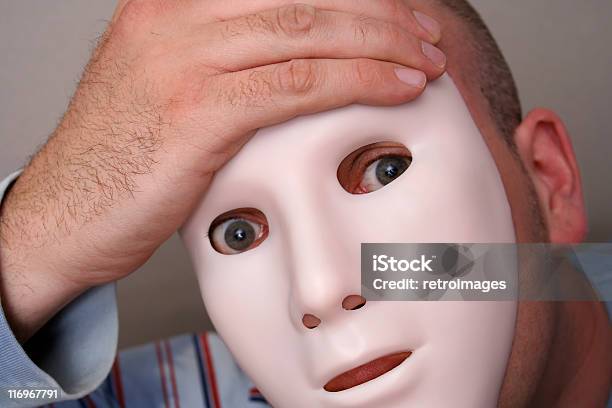 Man Holding Expressionless Mask To Face Stock Photo - Download Image Now - Hiding, Human Eye, Simplicity