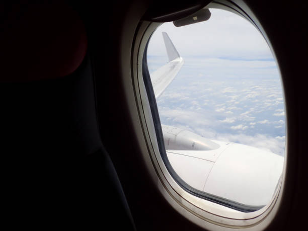 istock Beautiful and stunning view looking through window aircraft during flight in wing with a nice blue sky. 1169680462