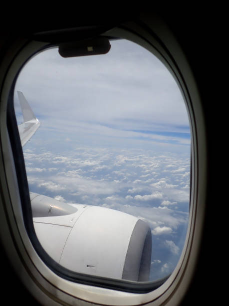 istock Beautiful and stunning view looking through window aircraft during flight in wing with a nice blue sky. 1169680502