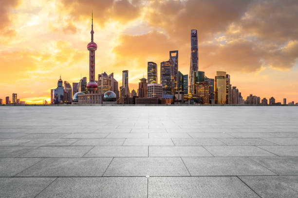 istock Shanghai skyline and modern buildings with empty square floor at sunrise 1169684371