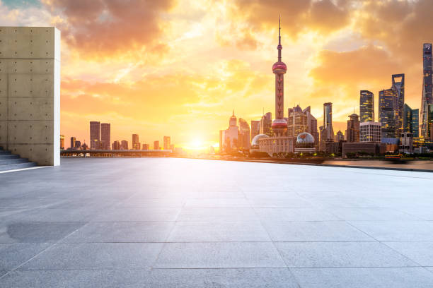 istock Shanghai skyline and modern buildings with empty square floor at sunrise 1169684596