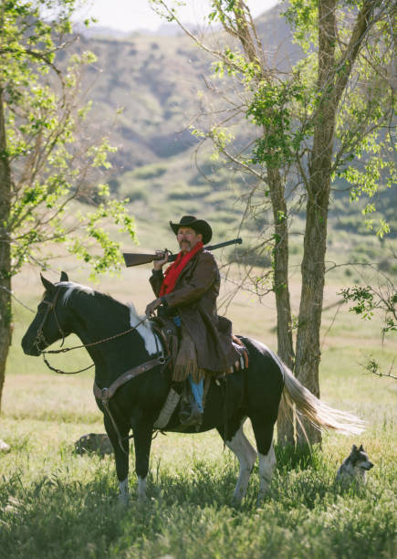 istock Cowboy sheriff with paint horse 1169687558