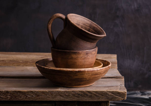 istock clay dishes on an old wooden table 1169689277