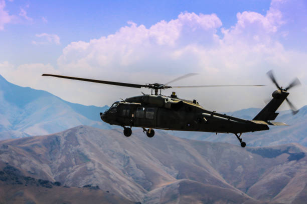 istock Military Utility Helicopter in flight 1169690075