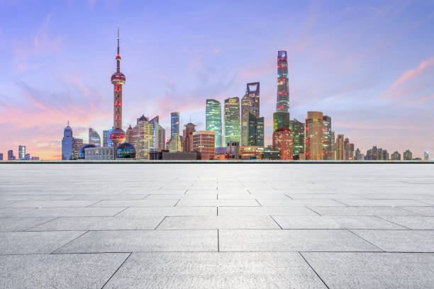 istock Shanghai skyline and modern buildings with empty square floor at sunrise 1169691269