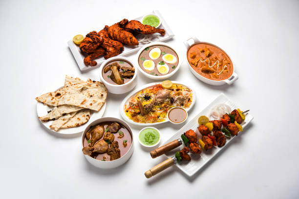 istock Assorted Indian Non Vegetarian food recipe served in a group. Includes Chicken Curry, Mutton Masala, Anda/egg curry, Butter chicken, biryani, tandoori murg, chicken-tikka and naan/roti 1169692222