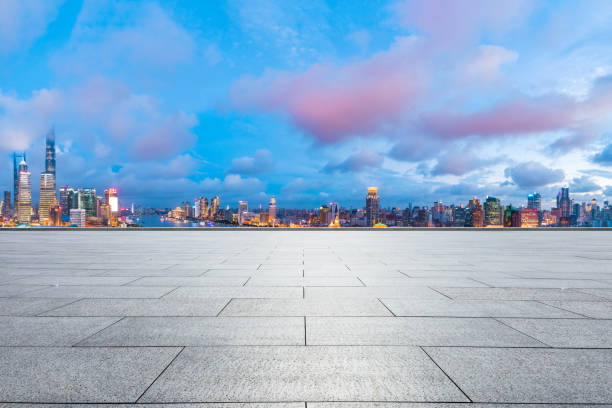 istock Shanghai skyline and modern buildings with empty square floor at night,China. 1169692384