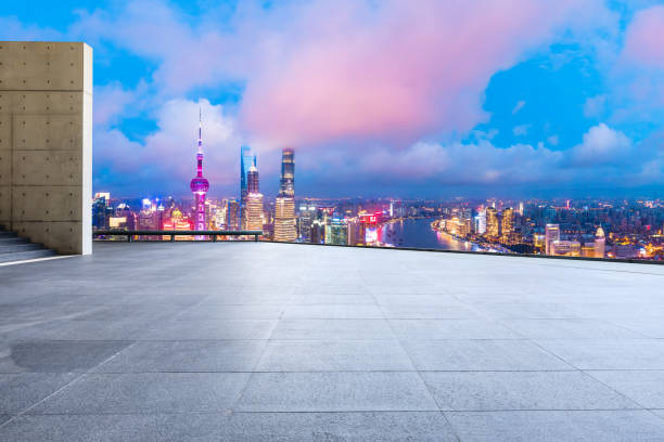 istock Shanghai skyline and modern buildings with empty square floor at sunrise,China. 1169693095