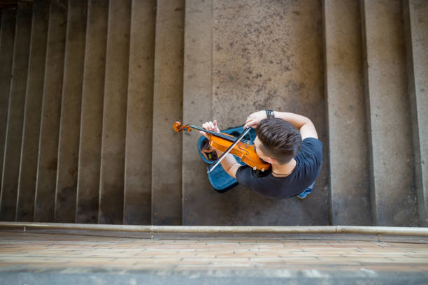 istock Street musician playing violin 1169693439