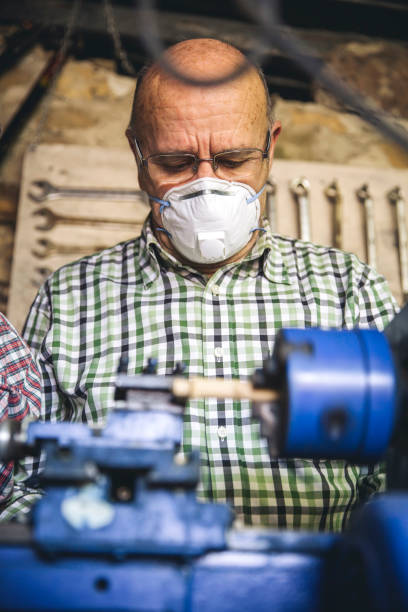 istock Senior man working in a carpentry 1169694897