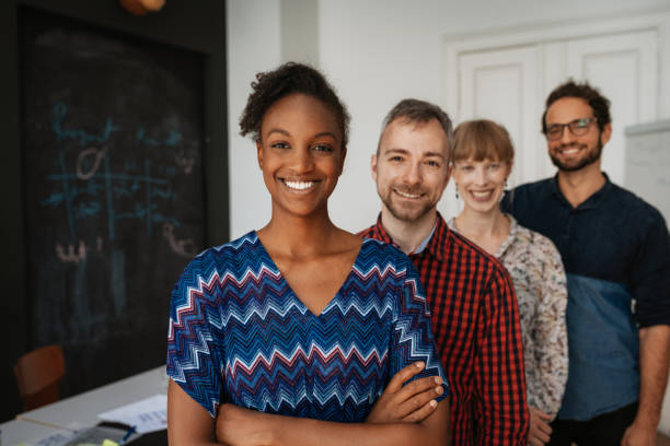 istock Multi-ethnic millennial teamwork working in coworking space 1169695924