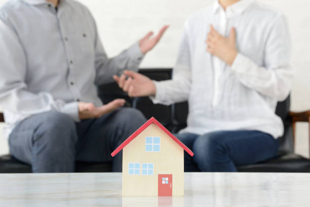 istock Man and woman talking about housing problems 1169695925