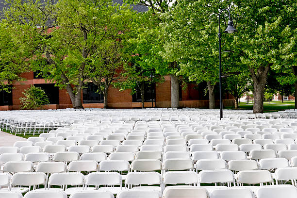 istock White Chairs Set Up for College Graduation 116969670