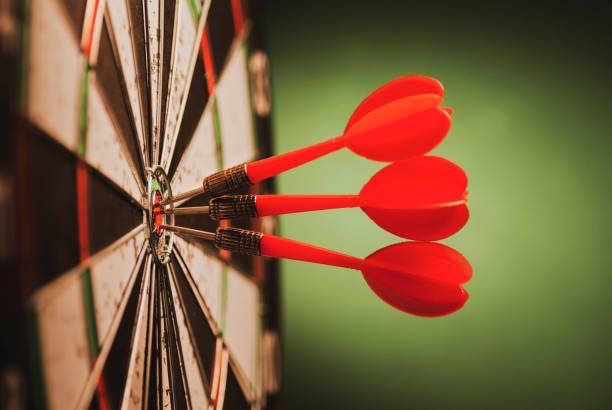 istock Cluster of three red darts on a target 1169698687