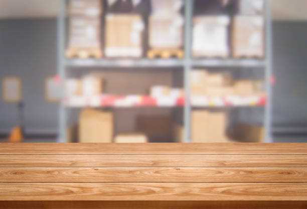 istock Wood table with blur beautiful background for your product display. 1169699933
