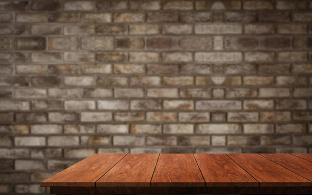 istock Wood table with blur beautiful background for your product display. 1169700009