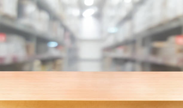 istock Wood table with blur beautiful background for your product display. 1169700082
