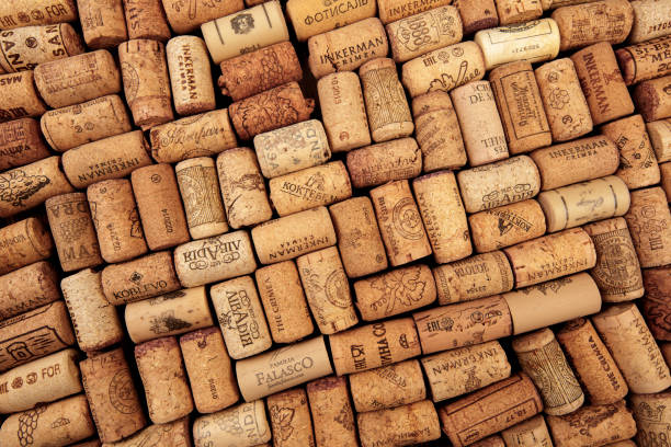 istock Closeup pattern background of many different wine corks with dates and drops of wine 1169700295