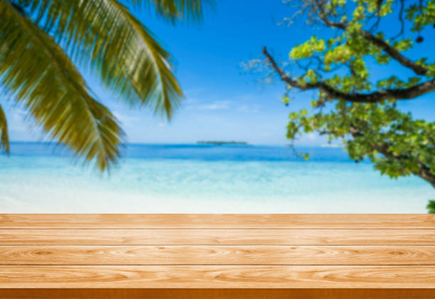 istock Wood table with blur beautiful background for your product display. 1169700432