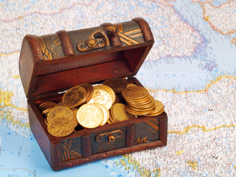 Treasure chest with gold coins and carta marina