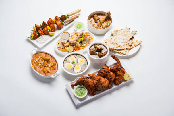 istock Assorted Indian Non Vegetarian food recipe served in a group. Includes Chicken Curry, Mutton Masala, Anda/egg curry, Butter chicken, biryani, tandoori murg, chicken-tikka and naan/roti 1169706525