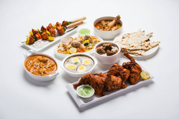 istock Assorted Indian Non Vegetarian food recipe served in a group. Includes Chicken Curry, Mutton Masala, Anda/egg curry, Butter chicken, biryani, tandoori murg, chicken-tikka and naan/roti 1169706673