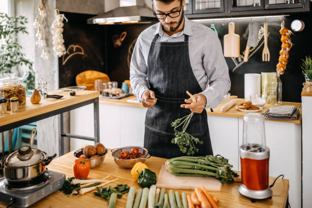 istock Man in kitchen, preparing healthy breakfast 1169707151