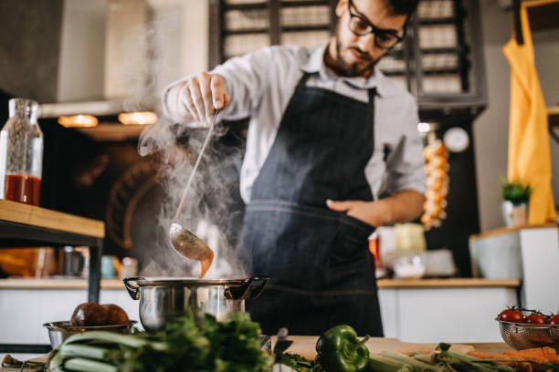 istock Man tasting his food before serving it 1169707258