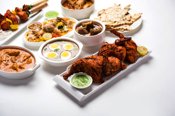 istock Assorted Indian Non Vegetarian food recipe served in a group. Includes Chicken Curry, Mutton Masala, Anda/egg curry, Butter chicken, biryani, tandoori murg, chicken-tikka and naan/roti 1169707282