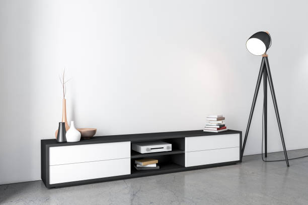 istock Tv console bureau mockup in empty room with lamp 1169710151