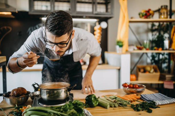 istock Man tasting his food before serving it 1169711203