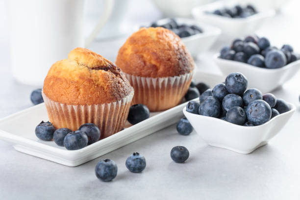 istock Muffins and blueberry on white table. 1169713630
