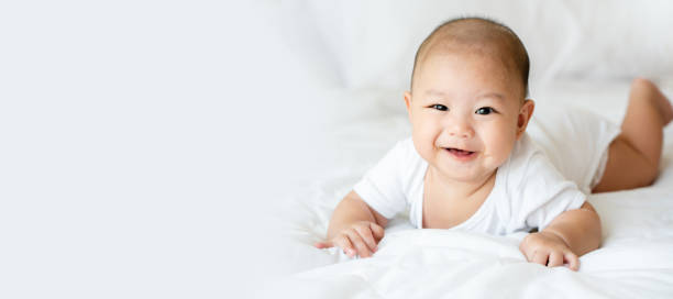 Asian newborn children must be cared for in development of the body. Visual skills Cleanliness of clothes, housing And should check the menstrual health at hospital. Banner background with copy space stock photo