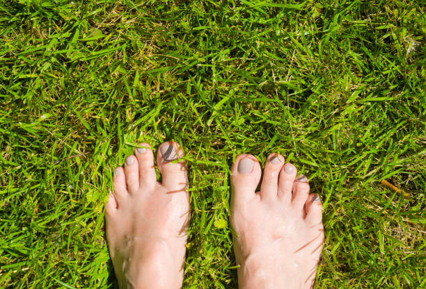 istock Young woman standing in grass 1169714034